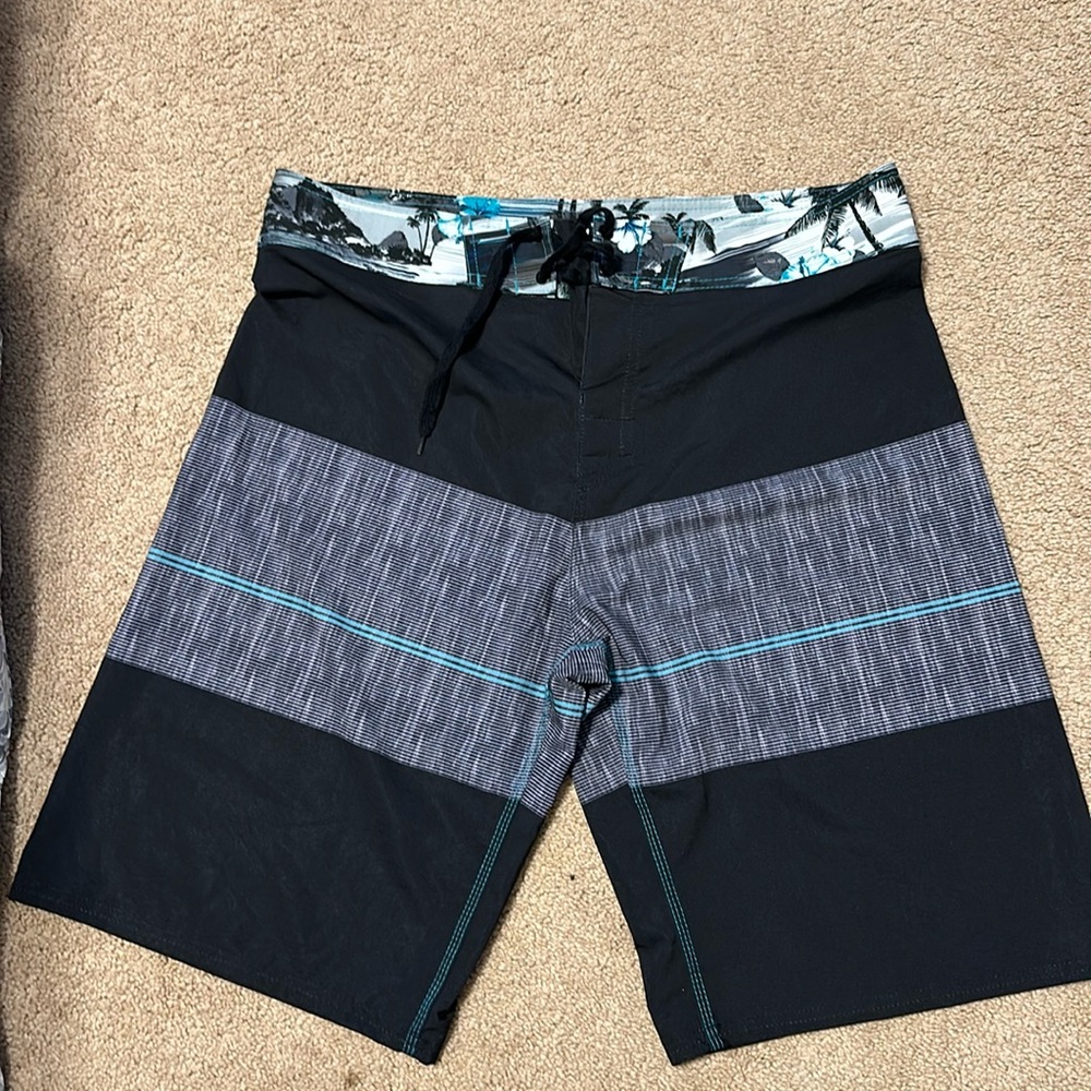 Men’s baiting suit. NWOT, bottle opener attached to back pocket! Size 36.